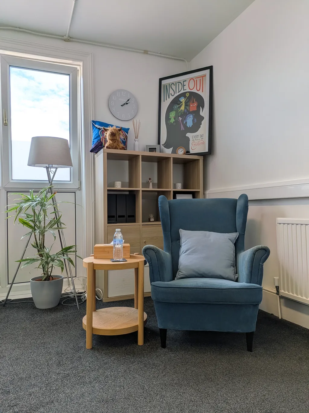 Comfortable blue armchair in the Worcester Park Counselling therapy room
